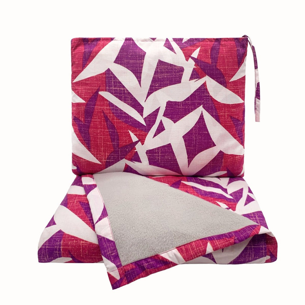 Hawaiian Airlines NOHO HOME travel blanket in pink on white background