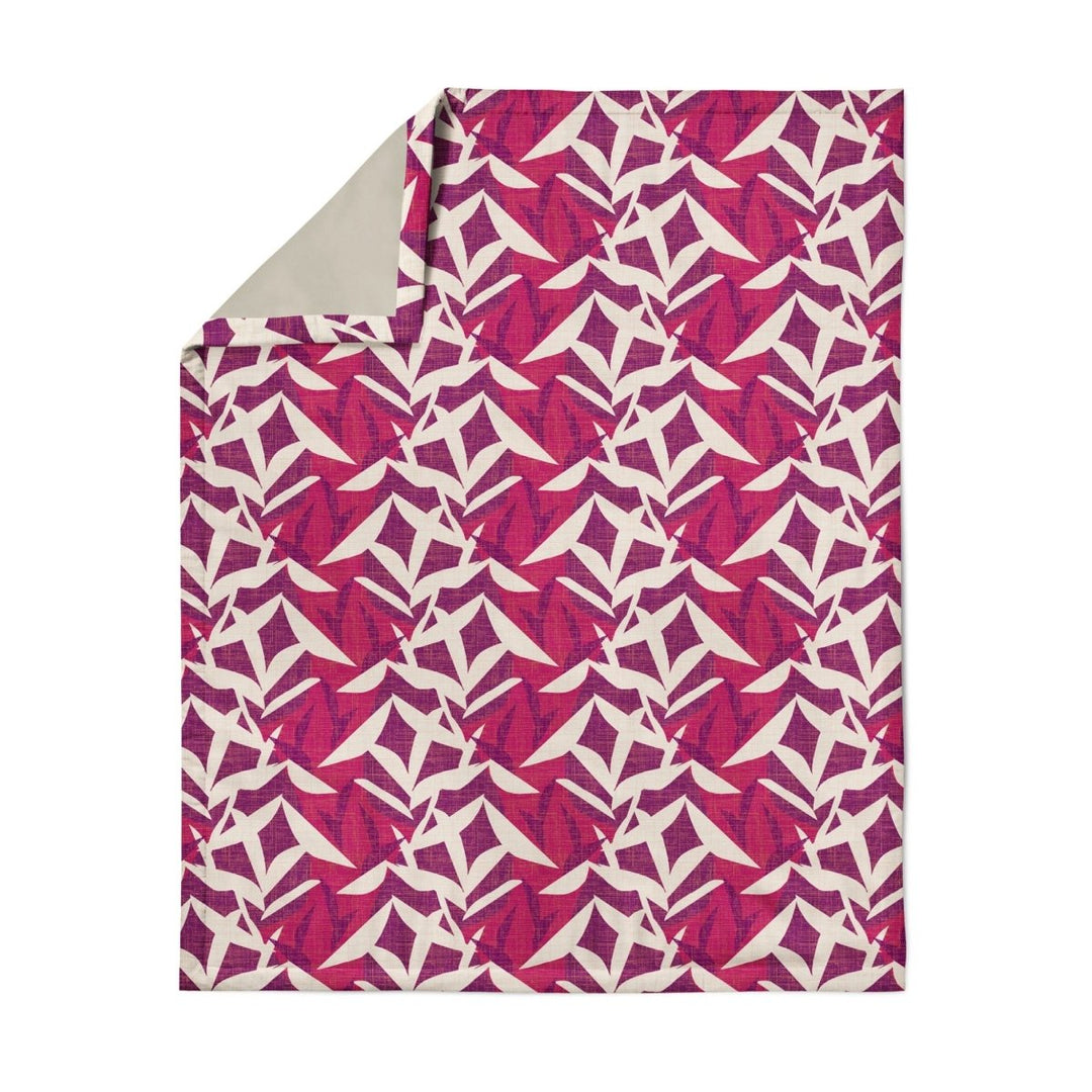 Hawaiian Airlines NOHO HOME travel blanket in pink showing full pattern on white background