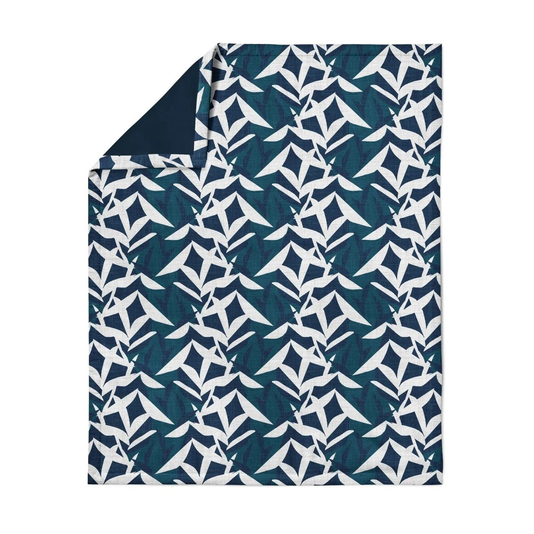 Lele Travel Blanket in Twilight, unfolded — Native Hawaiian ʻiwa bird pattern by NOHO HOME.