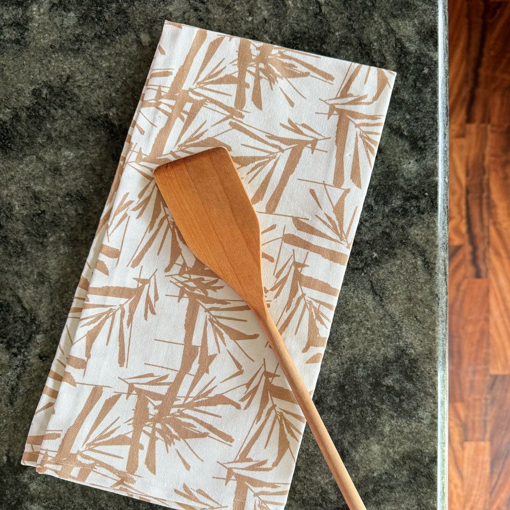  Limu Tea Towel On a Marble Countertop With a Wood Spoon On Top