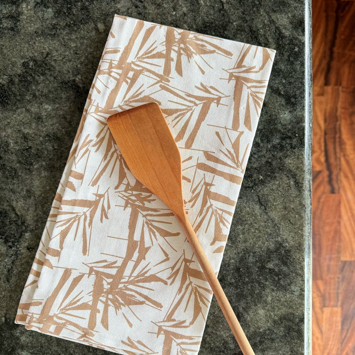  Limu Tea Towel On a Marble Countertop With a Wood Spoon On Top