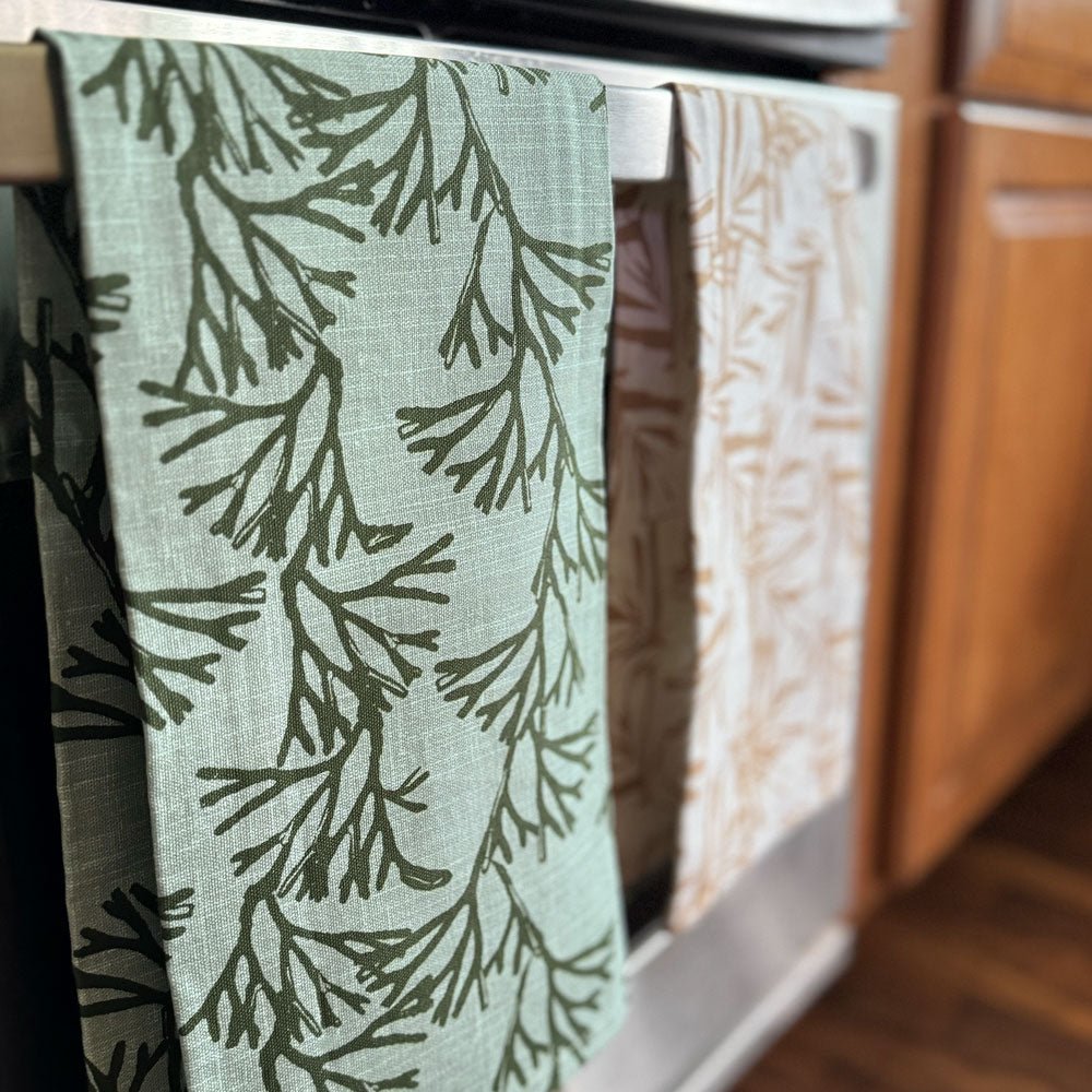  Limu Tea Towels Hanging On a Oven Door
