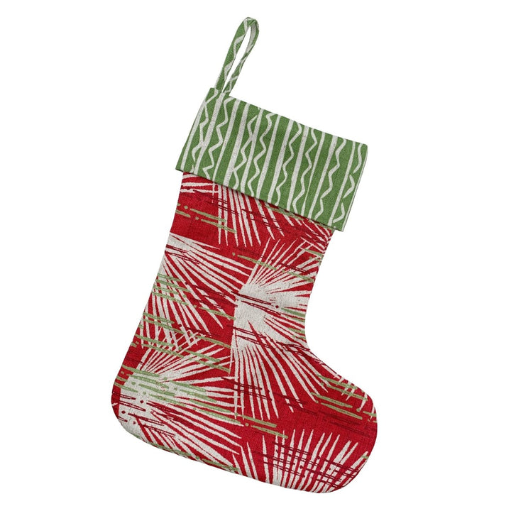 Red and green patterned Christmas stocking on a white background