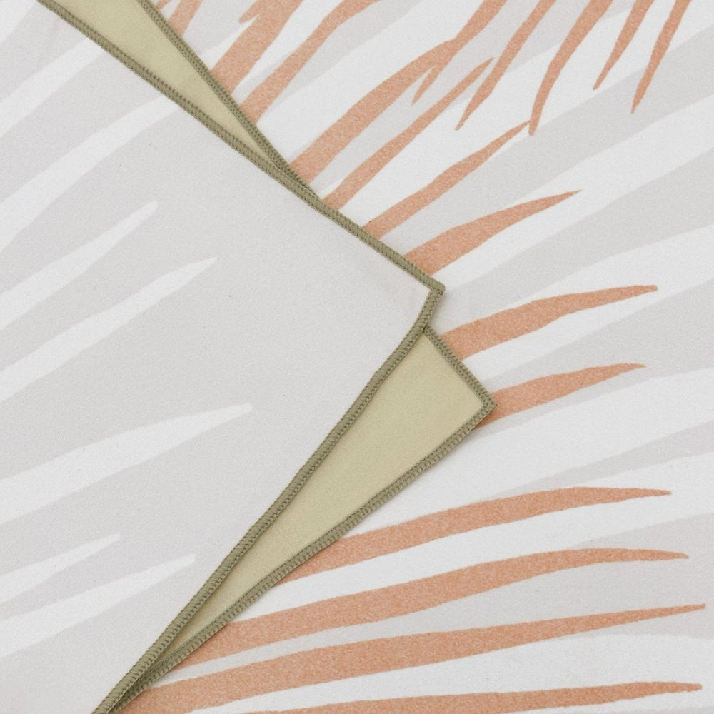 Close-up of Loulu Microfiber Beach Towel - front and back, as well as edge stitching