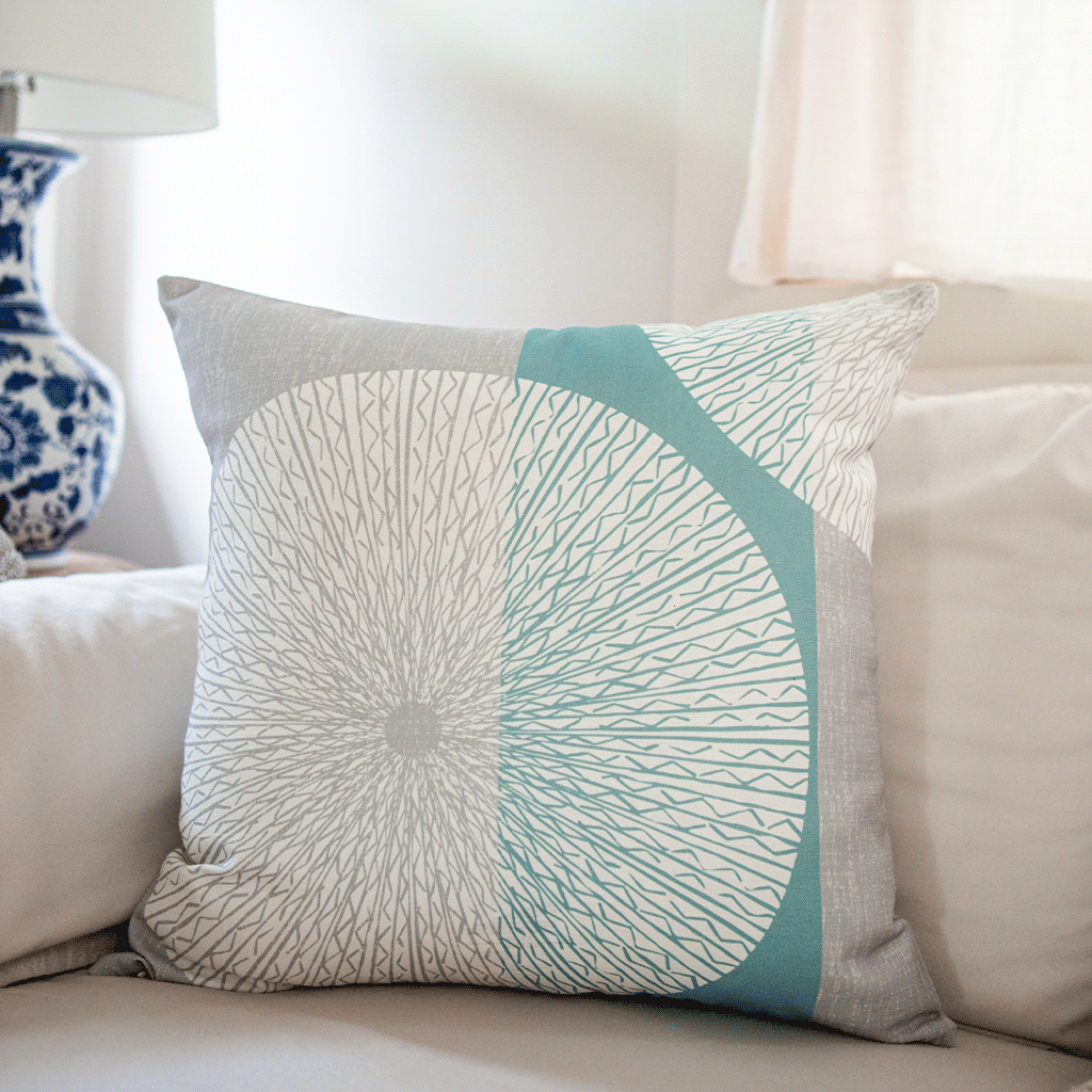 Snow & Frost Niho Medallion Square Pillow on an ivory sofa