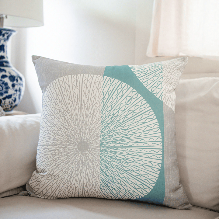 Snow & Frost Niho Medallion Square Pillow on an ivory sofa