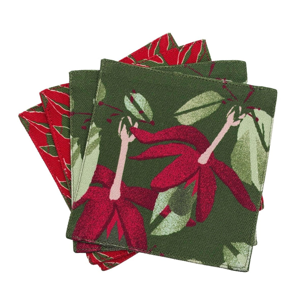 Stack of four NOHO HOME x Honolulu Cookie coasters with the Kokiʻo ʻUlaʻula print on top