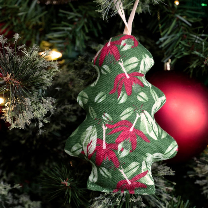 Kokiʻo ʻUlaʻula mini tree ornament hanging on a holiday tree