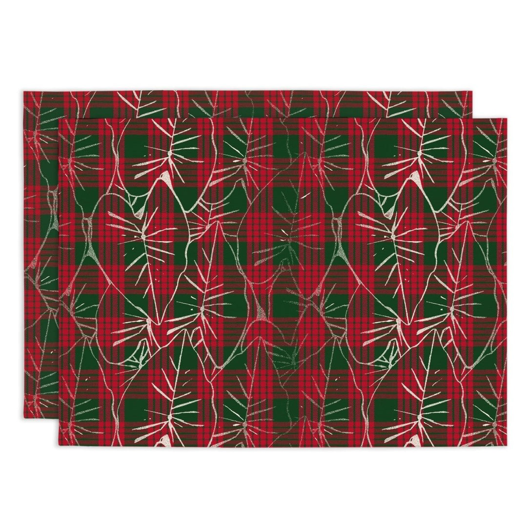 Red and green plaid pattern with white kalo leaf shapes on a white background