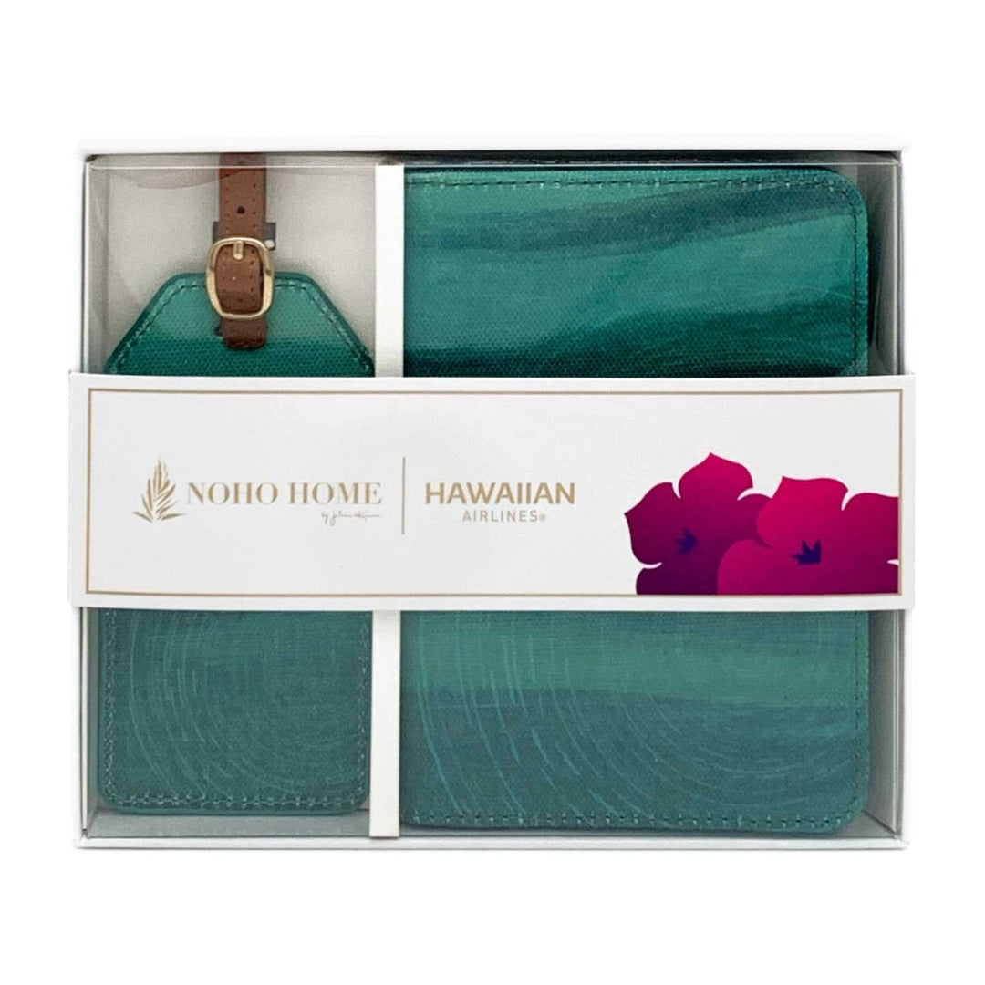 Teal luggage tag and wallet set with 'Noho Home' and 'Hawaiian Airlines' branding in packaging.