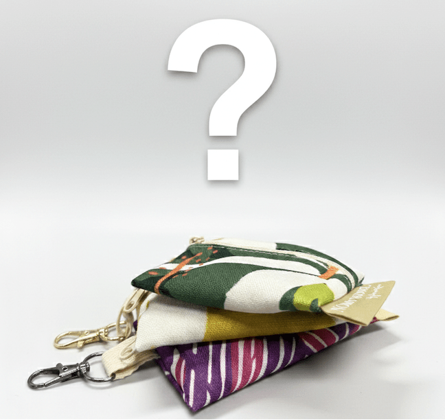 Colorful fabric pouches with a keychain on a light gray background