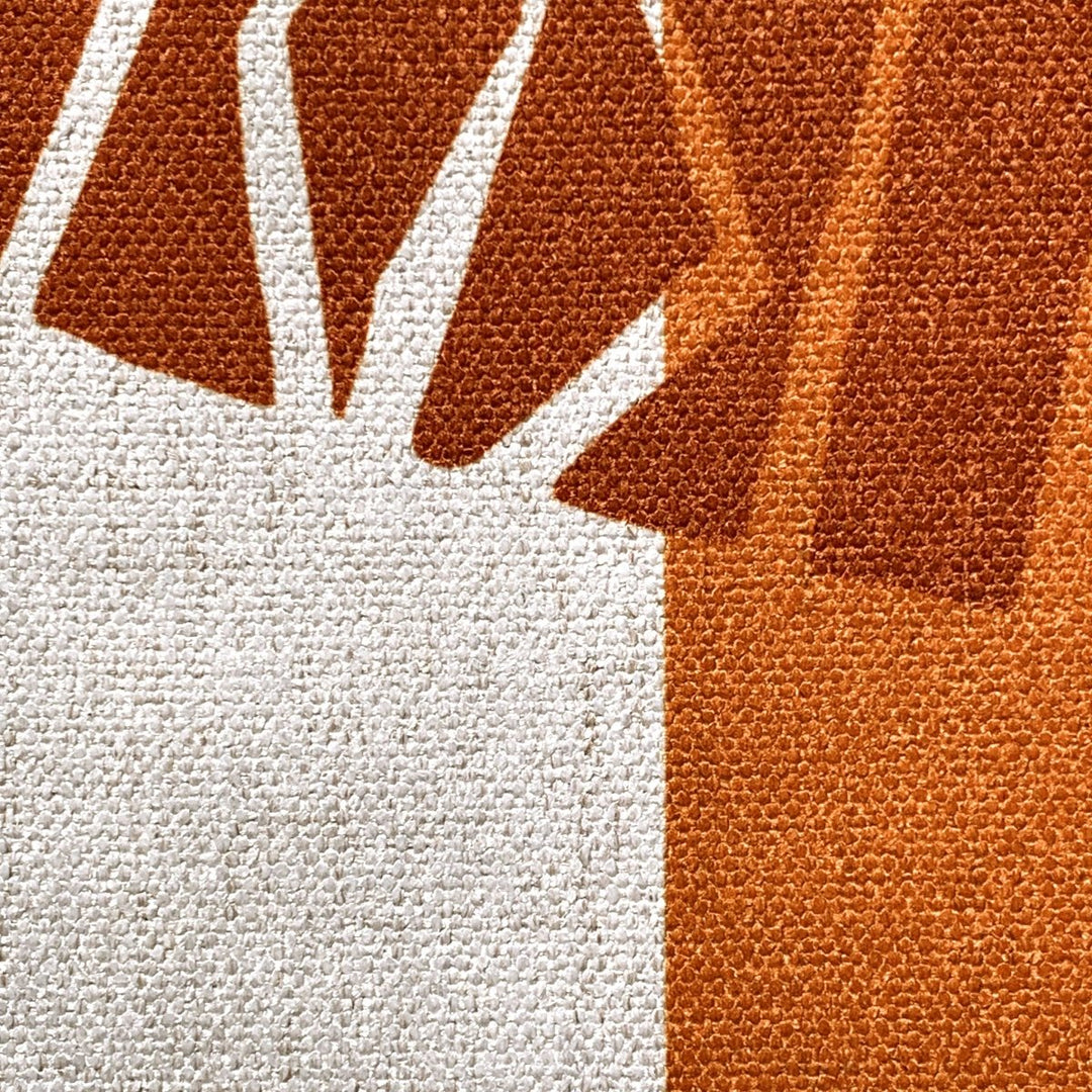 An up close look at the beautiful Orange Niho Medallion table runner.