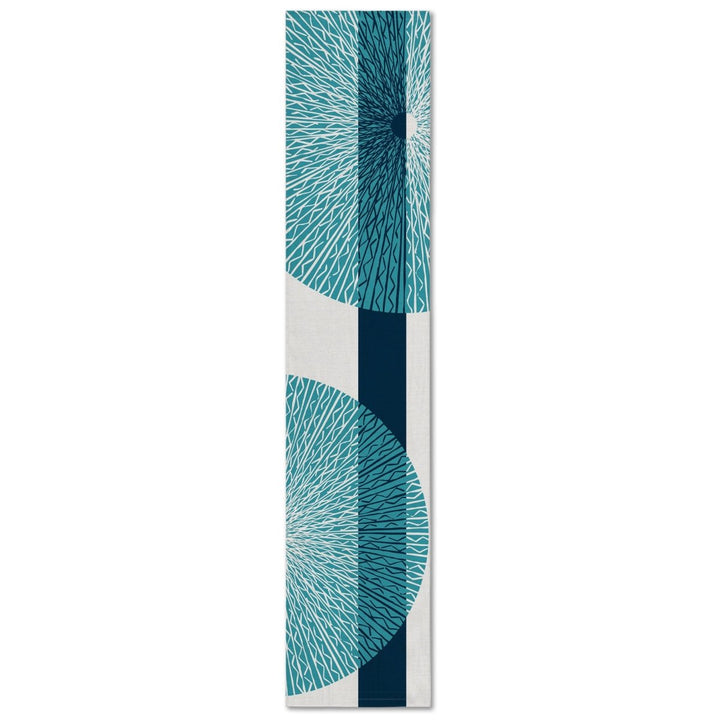 A rectangular table runner with a white background and blue niho medallion pattern.