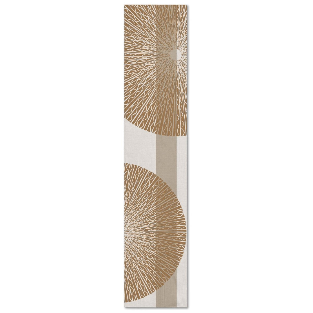 A rectangular table runner with a white background and gold niho medallion pattern.