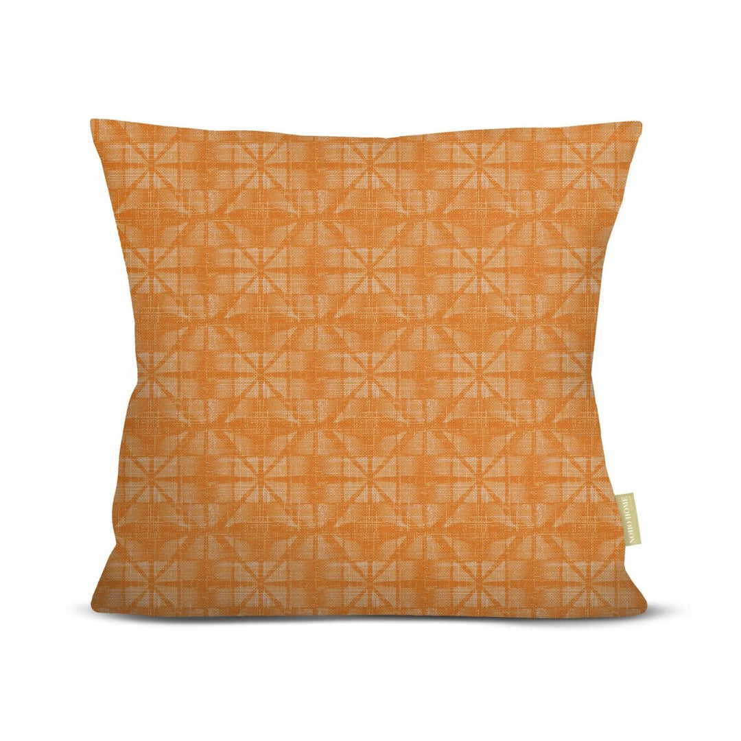 Orange pillow with geometric pattern on a white background