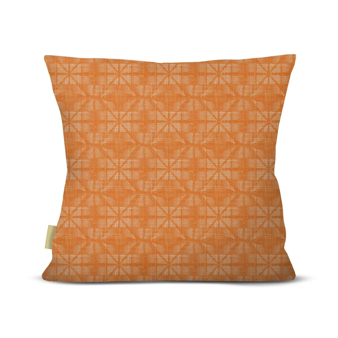 Orange pillow with geometric pattern on a white background