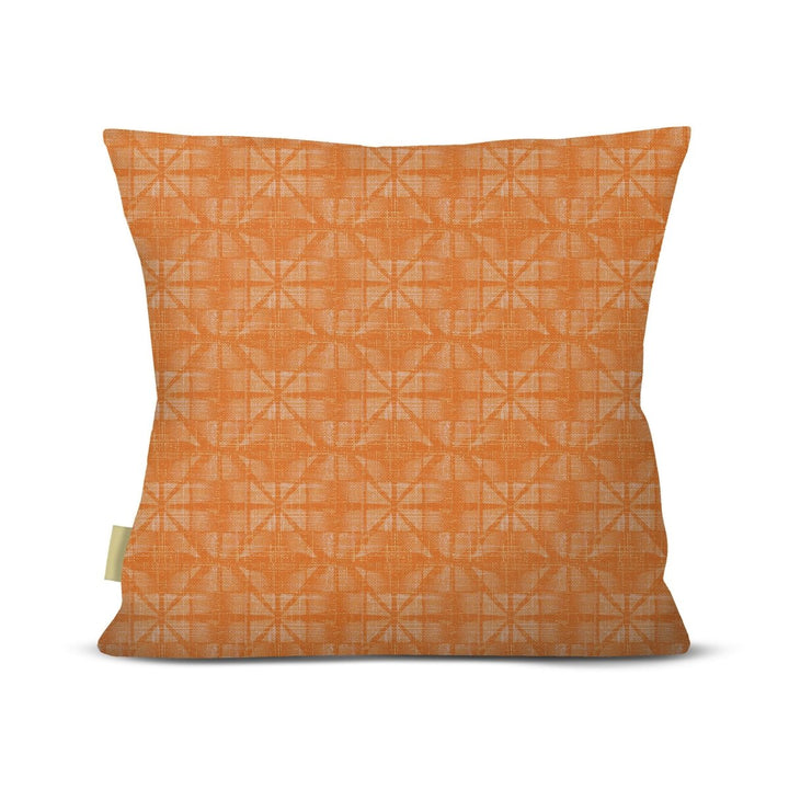 Orange pillow with geometric pattern on a white background