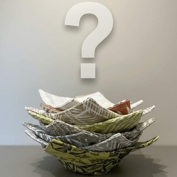 Stack of bowl cozies with a question mark above on a neutral background