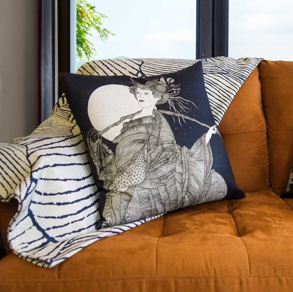 Ryokō-sha Square Pillow Set On an Orange Couch with a Coastal Throw Behind It