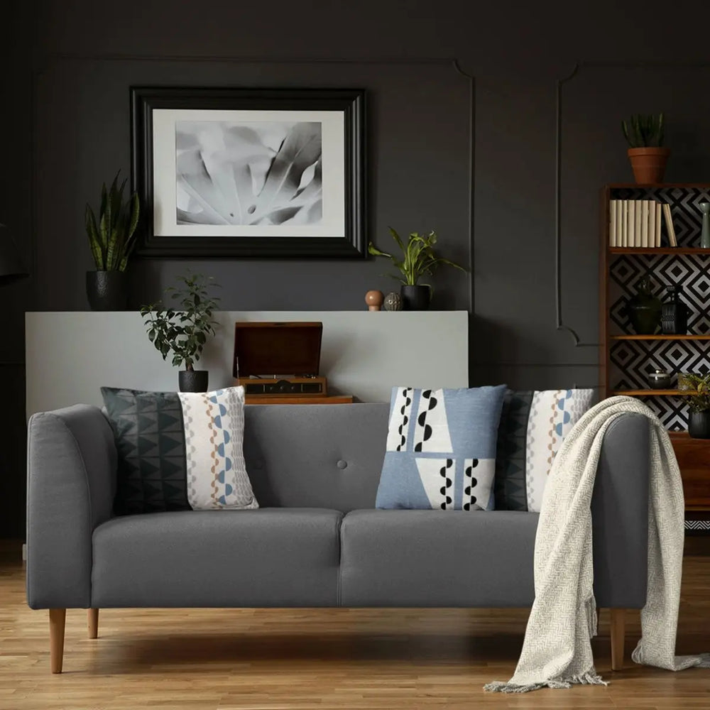 Black and Beige Tatau Pō Square Pillow Set On a Grey Modern Couch