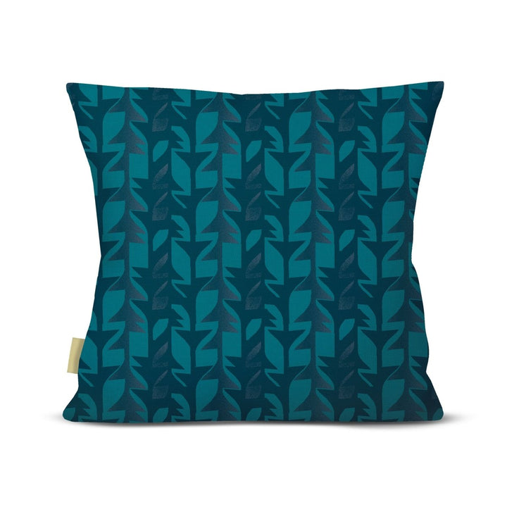 Blue patterned pillow on a white background