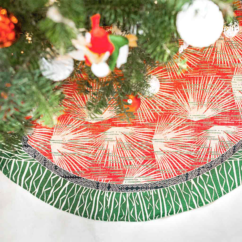 Loulu Tree Skirt In Red and Green Under a Christmas Tree