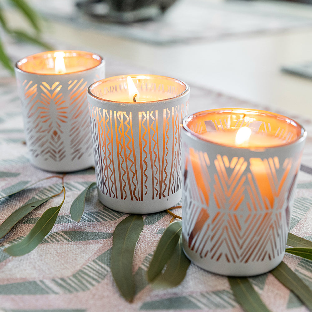 Lit Nā Pua Aʻala Collection on some Eucalyptus leaves covering a tablecloth.