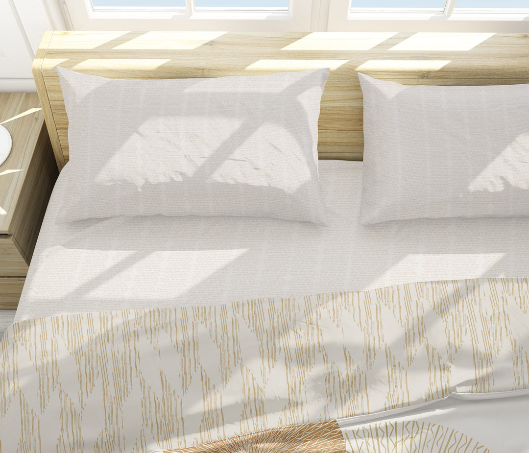 Kua Luxury Sheet Set Shown On a Bed With Two PIllows