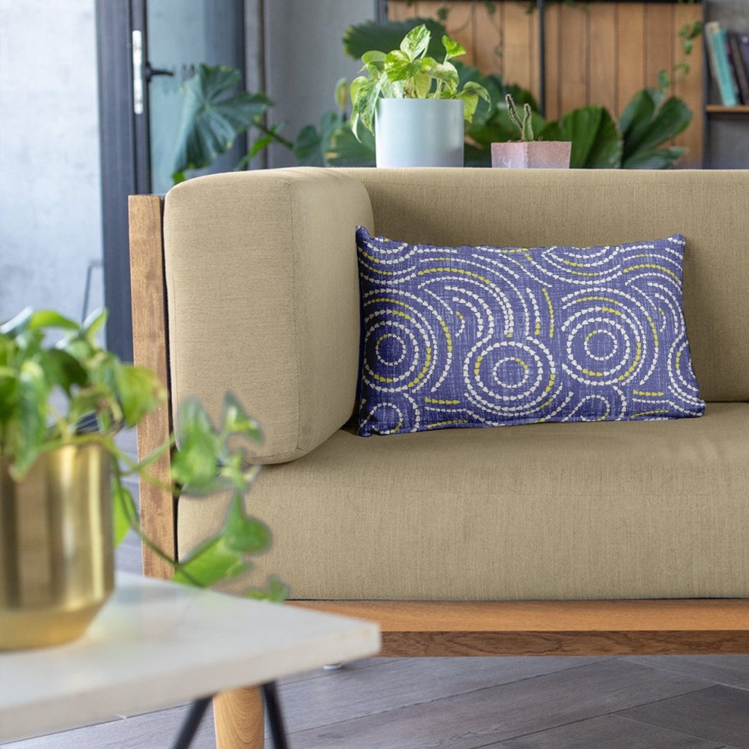 Ivory and Lavender Crown Flower Lumbar Pillowcase On a Beige Couch