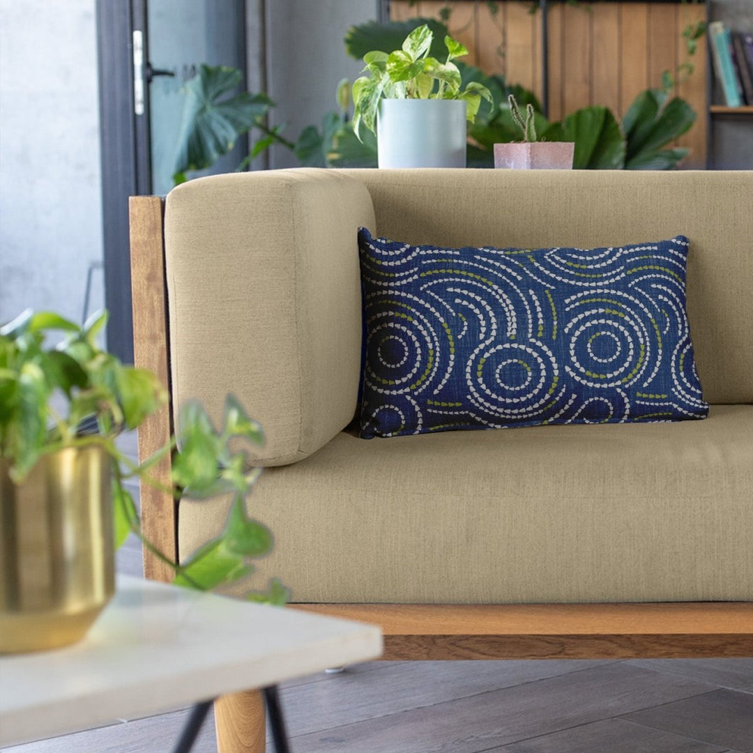 Ivory and Navy Crown Flower Lumbar Pillowcase Set On a Biege Couch