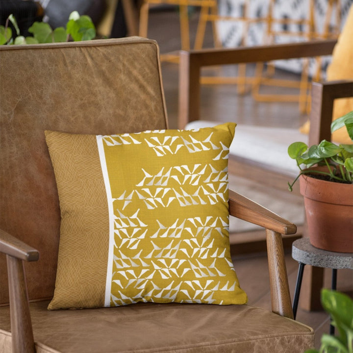 Chartreuse Huki Square Pillowcase Set On a Leather Chair With Wood Arms