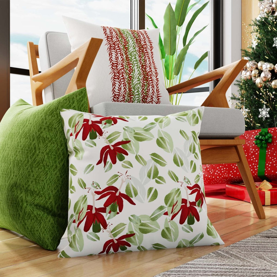 Red Kokio Ulaula Square Pillow Sitting On a Wood Floor Next to a Green Pillow