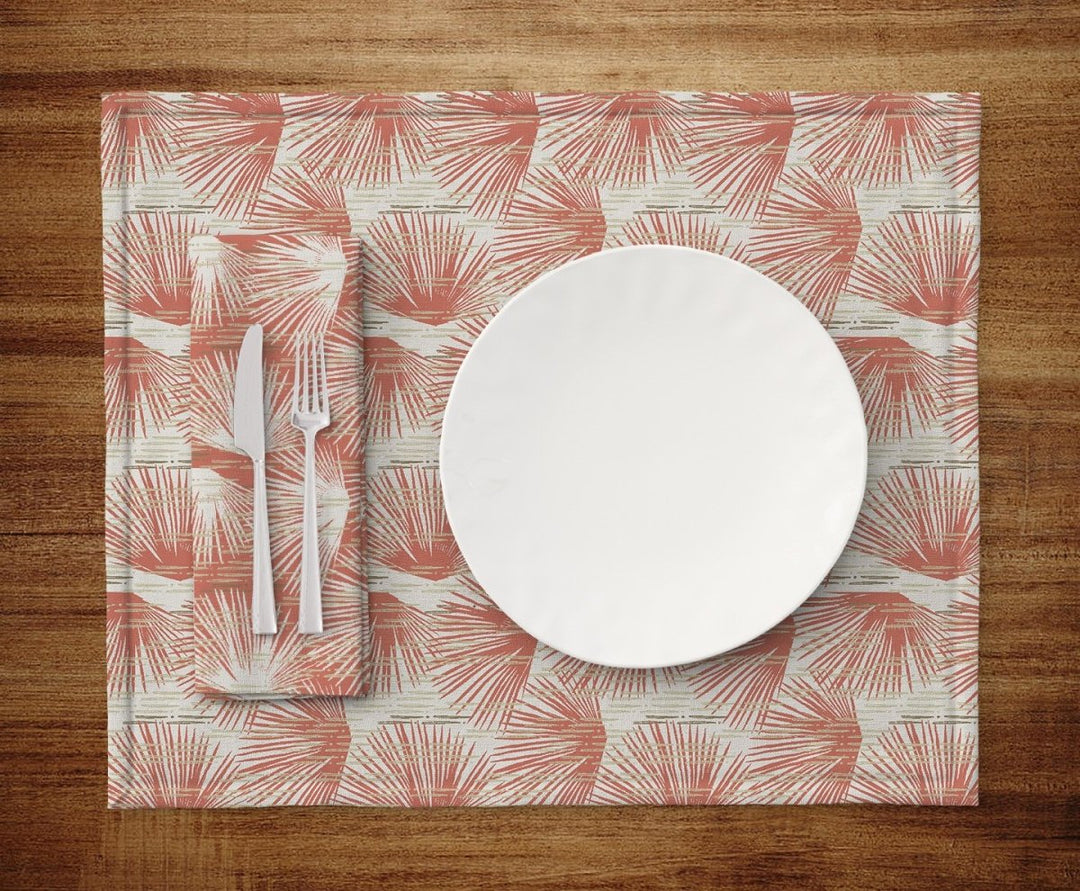 Table setting of plate, silverware, napkin and Red and Ivory Loulu Dining Placemat Set