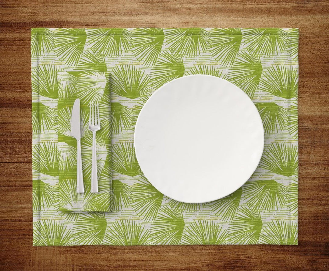 Table setting of plate, silverware, napkin and Green and Ivory Loulu Dining Placemat Set