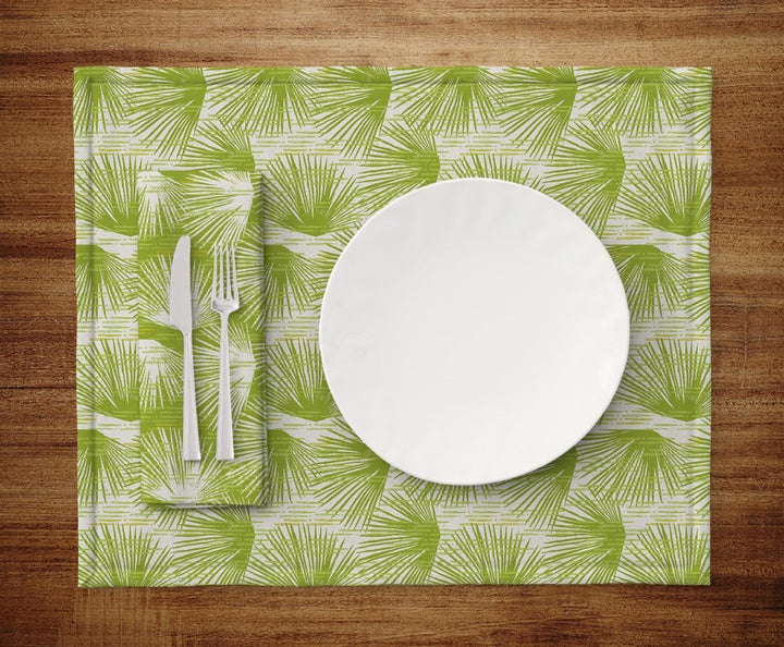 Table setting of plate, silverware, napkin and Green and Ivory Loulu Dining Placemat Set