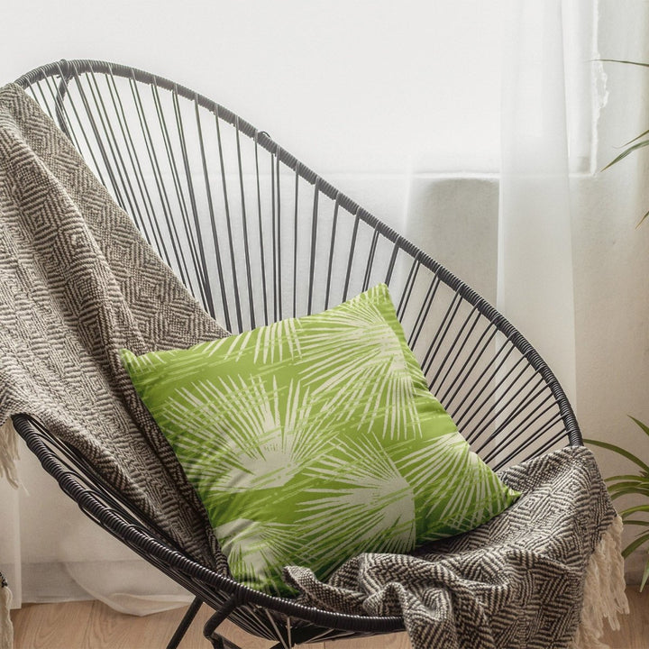 Celery Loulu Square Pillow Set On a Lounge Metal Chair With a Coastal Throw Blanket