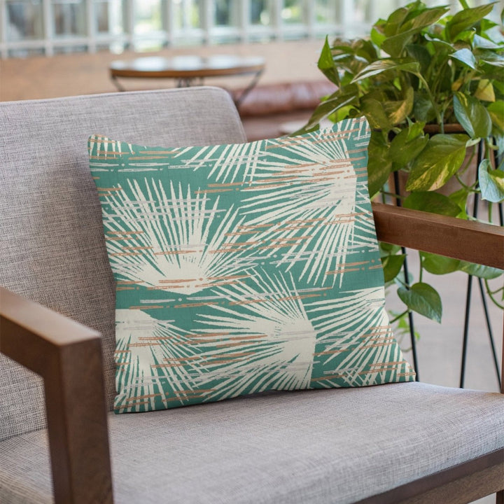 Green Flash Loulu Square Pillow Set On a Grey Fabric Chair With Wood Arms