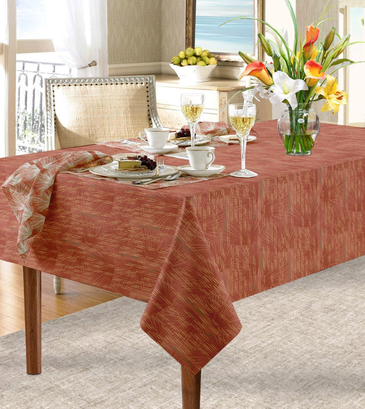 Red Loulu Tablecloth draped over table paired with Loulu napkin.  Floral arrangement, wine glasses, cups and saucers and place settings complete the look.
