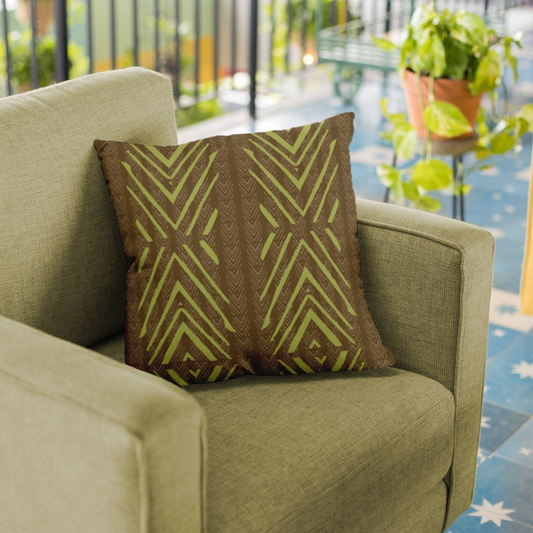 Moss and Brown Tiki Square Pillowcase on an olive chair